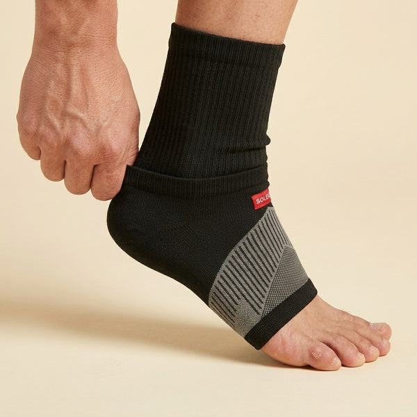 Step 1 - slip sock onto foot, heel-cup covers heel