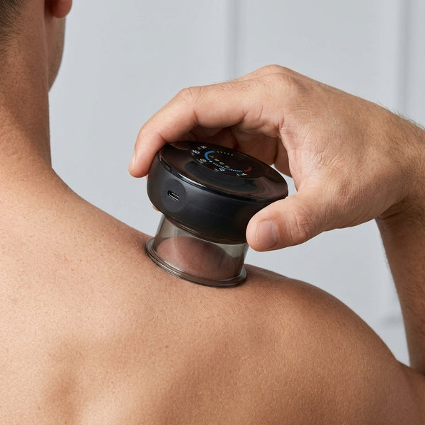 Placing the cupping massager onto the upper back