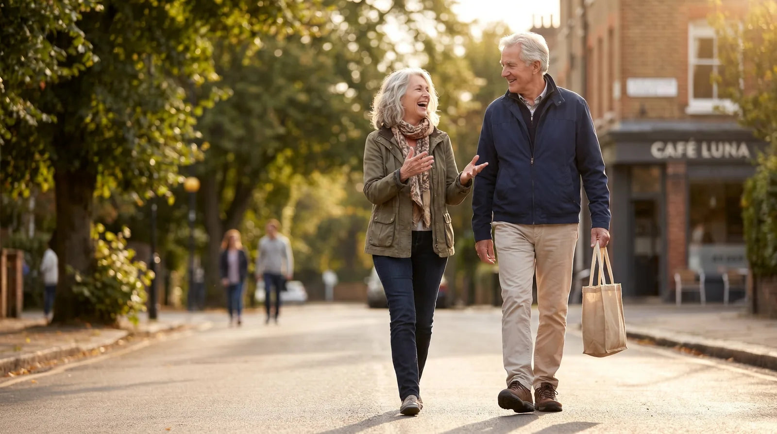 Older couple energetic outdoors in late afternoon